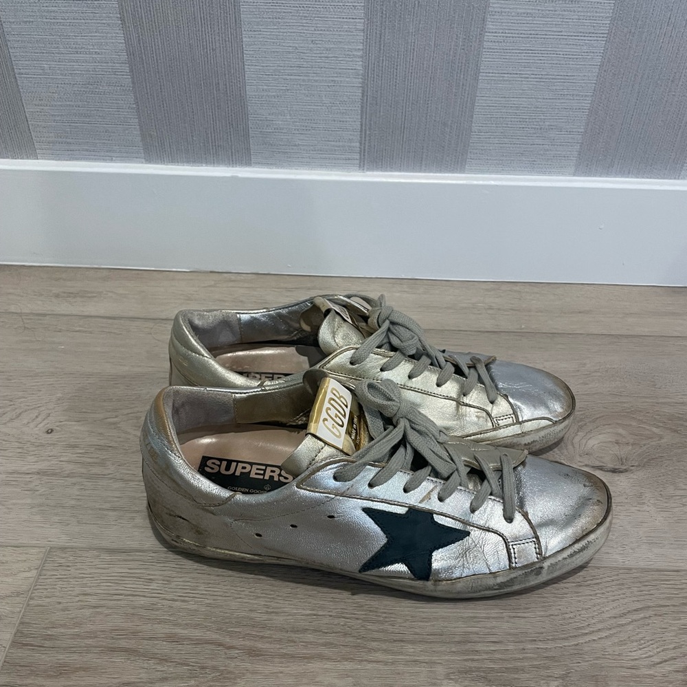 Golden goose silver and gold superstar sneakers